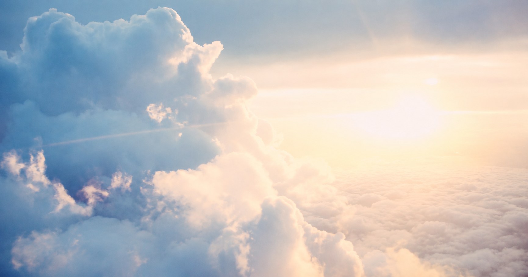 Clouds drifting in the sky at sunrise